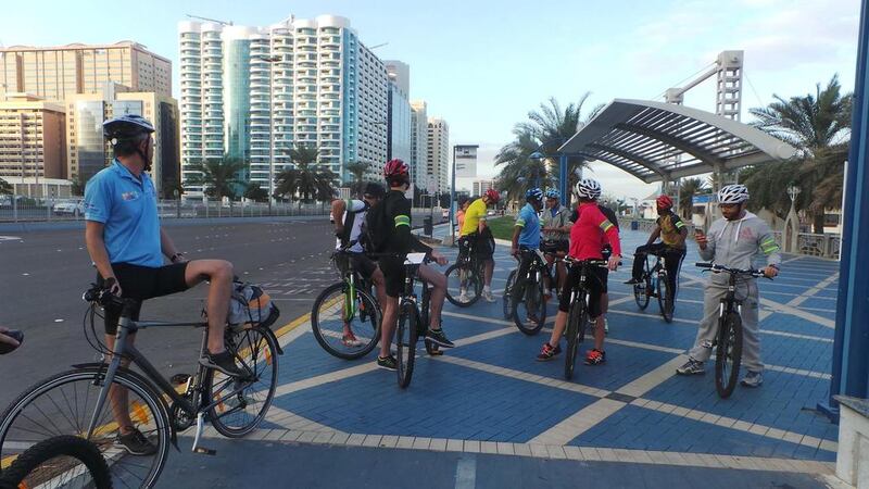 Total staff take a moment on Abu Dhabi Corniche during their ride from the Hiltonia to Abu Dhabi Mall. Photo courtesy Ramesh Menon