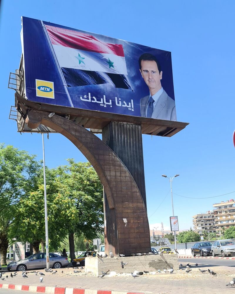Another Syrian telecommunications provider MTN says "Our hand with yours" with Assad's picture 