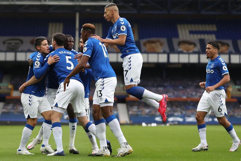 Everton's Michael Keane celebrates with teammates after scoring. AFP