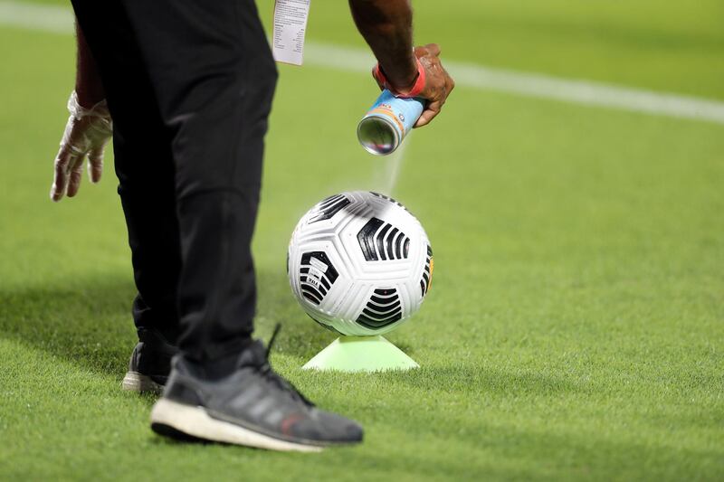 Sharjah, United Arab Emirates - Reporter: John McAuley. Sport. The ball is disinfected. Shabab Al Ahli v Al Nasr in the Arabian Gulf Cup Final. Friday, April 9th, 2021. Sharjah. Chris Whiteoak / The National