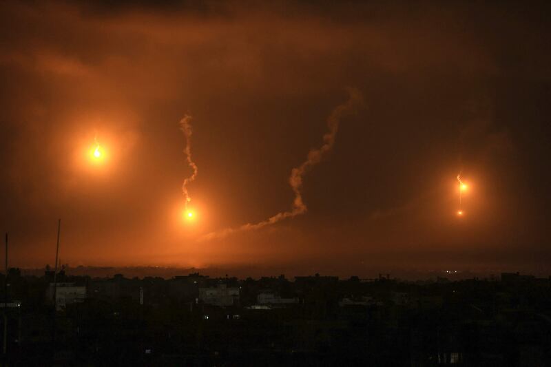 Israeli flares light the sky above Khan Younis in the southern Gaza Strip. AFP