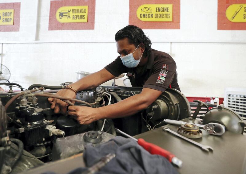 Dubai, United Arab Emirates - Reporter: N/A. News. Coronavirus/Covid-19. Members of Regal Auto care fix cars with Covid protection measures in place. Tuesday, September 1st, 2020. Dubai. Chris Whiteoak / The National