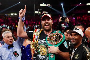 Boxing - Tyson Fury v Deontay Wilder - WBC Heavyweight Title - T-Mobile Arena, Las Vegas, Nevada, U. S.  - October 9, 2021 Tyson Fury celebrates with the belts after winning the fight against Deontay Wilder REUTERS / Steve Marcus