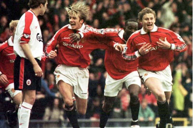 THIS PICTURE MAY ONLY BE USED WITHIN THE CONTEXT OF AN EDITORIAL FEATURE. Manchester United's Ole Gunnar Solskjaer (r) celebrates with team mate David Beckham, after scoring the winning goal in the FA Cup 4th round clash against Liverpool. 