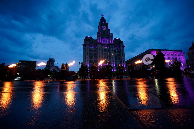 Platinum jubilee beacons are lit outside the Royal Liver Building, Liverpool, England, Thursday June 2, 2022, on day one of Queen Elizabeth II's platinum jubilee celebrations. PA