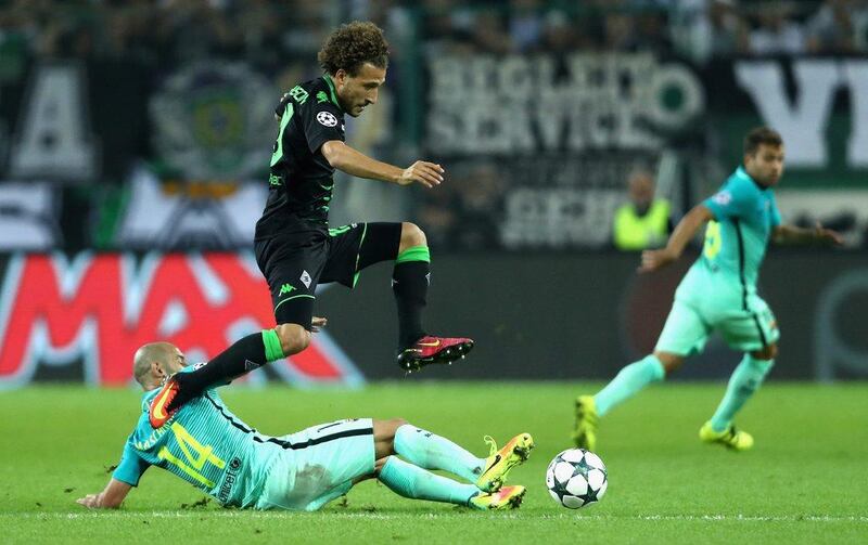 Fabian Johnson of Borussia Monchengladbach battles for the ball with Javier Mascherano of Barcelona. Alex Grimm / Getty Images