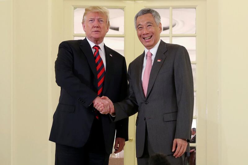 US president Donald Trump and Singapore's prime minister Lee Hsien Loong shake hands during a meeting at the Istana in Singapore. Jonathan Ernst / Reuters