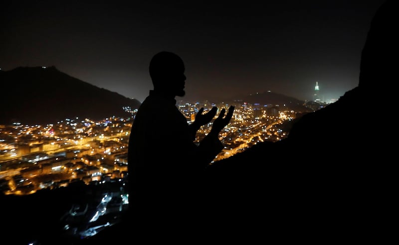 A Muslim pilgrim prays at Jebel Al Nour where the Prophet Mohammad received the first words of the Quran through Jabril in the Hera cave in the holy city of Mecca, Saudi Arabia. Suhaib Salem / Reuters