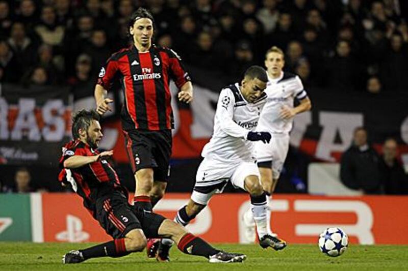 Spurs' Aaron Lennon dribbles past  AC Milan's Marek Jankulovski during their goalless draw in London.