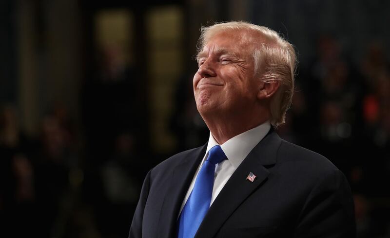 U.S. President Donald Trump smiles while delivering a State of the Union address to a joint session of Congress at the U.S. Capitol in Washington, D.C., U.S., on Tuesday, Jan. 30, 2018. Trump sought to connect his presidency to the nation's prosperity in his first State of the Union address, arguing that the U.S. has arrived at a "new American moment" of wealth and opportunity. Photographer: Win McNamee/Pool via Bloomberg