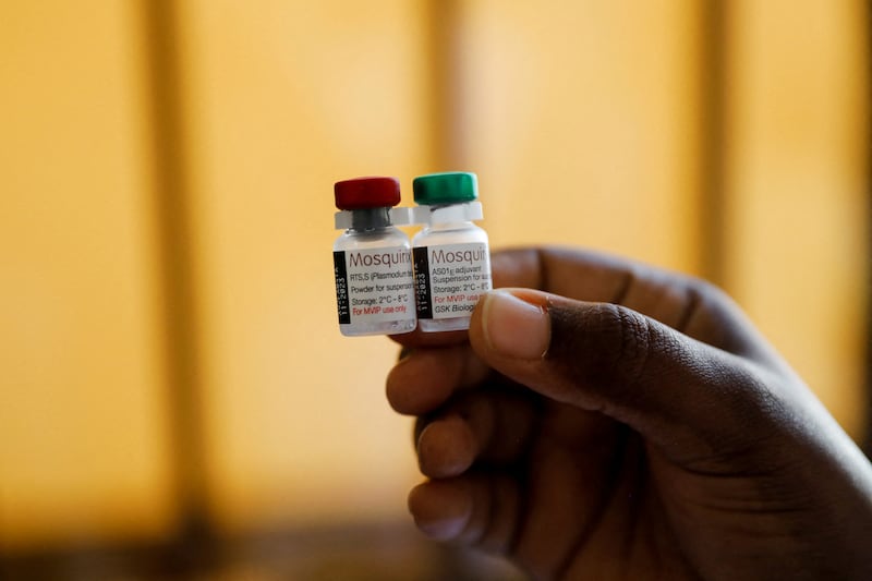 A nurse holds malaria vaccine vials at the Lumumba Sub-County Hospital in Kisumu, Kenya.  Reuters