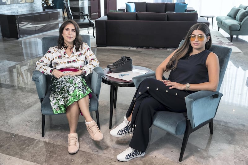 DUBAI, UNITED ARAB EMIRATES. 03 October 2017. STANDALONE. Nour Al Tamimi (White shirt) and Basma Chidiac (Blue) founders of the Nou Project with some of their art sneakers. (Photo: Antonie Robertson/The National) Journalist: Hafsa Lodi. Section: National.