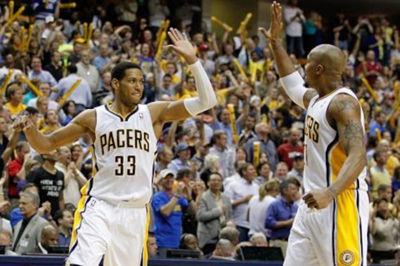 INDIANAPOLIS, IN - MAY 08: Danny Granger #33 of the Indiana Pacers celebrates a late fourth quarter three point basket with David West #21while playing the Orlando Magic in Game Five of the Eastern Conference Quarterfinals during the 2012 NBA Playoffs on May 8, 2012 at Bankers Life Fieldhouse in Indianapolis, Indiana. Indiana won the game 105-87 to to win the series 3-1. NOTE TO USER: User expressly acknowledges and agrees that, by downloading and or using this photograph, User is consenting to the terms and conditions of the Getty Images License Agreement.   Gregory Shamus/Getty Images/AFP== FOR NEWSPAPERS, INTERNET, TELCOS & TELEVISION USE ONLY ==

