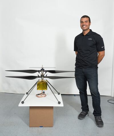 Loay Elbasyouni, with a Mars helicopter that he helped to design, is one of the judges at NYU Abu Dhabi's quantum computing hackathon.