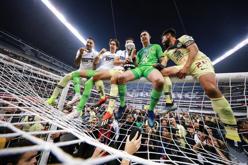 Players of America celebrate with teammates after winning the Torneo Apertura 2018 Liga MX at Azteca Stadium in Mexico City, Mexico. Getty Images