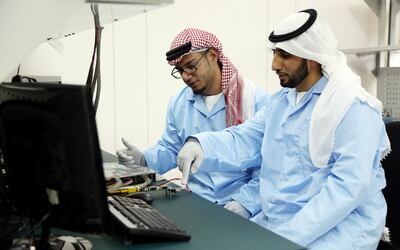 Dubai, 13,Sept,2017:  Engineers (L)   Mohsen Al Awadhi and (R) Mubarak Mohammed Al Ahbabi pose  during the interview at the Mohammed Bin Rashid Space Centre in Dubai. Satish Kumar / For the National  / Story by Caline Malek