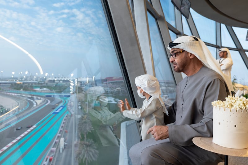 President Sheikh Mohamed and his grandson, Sheikh Zayed bin Theyab, watch the race of from Shams Tower. Photo: Ryan Carter / UAE Presidential Court