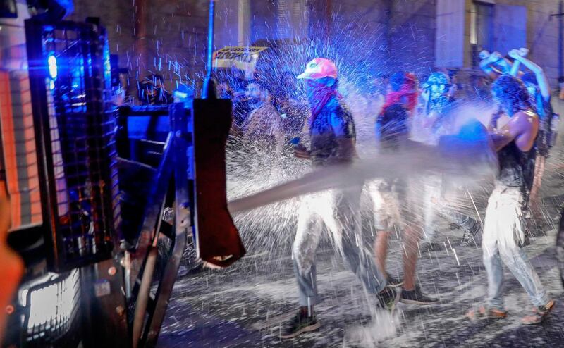 Israeli police spray protesters with water cannon during  a rally against Prime Minister Benjamin Netanyahu in Jerusalem. AFP