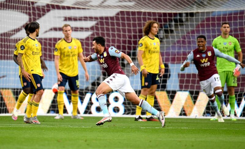 Aston Villa's Trezeguet, centre, celebrates after scoring. AP