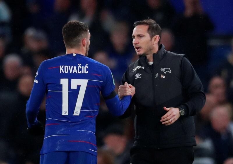 Frank Lampard shakes hands with Chelsea's Mateo Kovacic after the match. Reuters