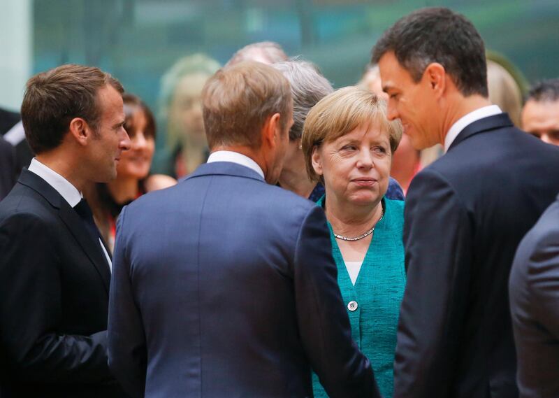 epa06847423 (L-R) French President Emmanuel Macron, European Council President Donald Tusk and German Chancellor Angela Merkel and Spanish Prime Minister Pedro Sanchez during an European Council summit in Brussels, Belgium, 28 June 2018. EU countries' leaders meet on 28 and 29 June for a summit to discuss migration in general, the installation of asylum-seeker processing centers in northern Africa, and other security- and economy-related topics including Brexit.  EPA/OLIVIER HOSLET