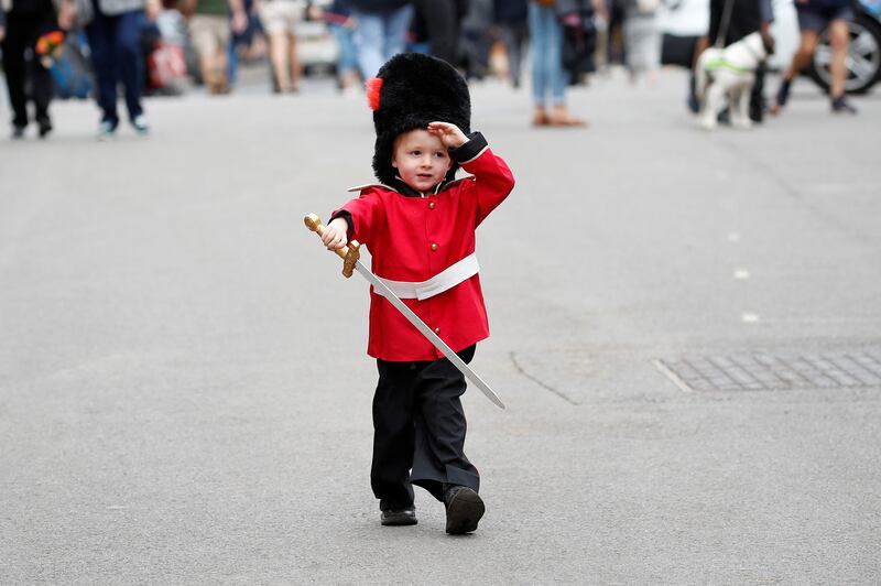 Bruce Pollard, 3, wearing a guardsman's costume, in Windsor, England following the death of Queen Elizabeth II. Reuters