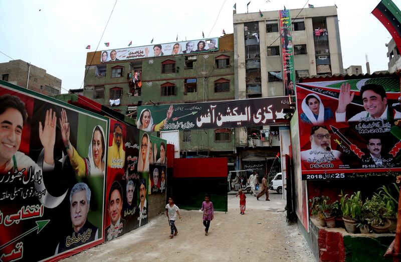 A street is decorated with banners for Bilawal Bhutto Zardari, leader of Pakistan Peoples Party, ahead of elections in Karachi, Pakistan, Wednesday, July 18, 2018. The election Commission announced that the country's security forces will be deployed to polling stations to ensure free, fair and transparent national elections on July 25. (AP Photo/Shakil Adil)