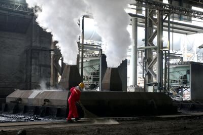 FILE PHOTO: A worker is seen at the workshop of a steel mill in Huaian, Jiangsu province, China August 4, 2018. REUTERS/Stringer/File Photo ATTENTION EDITORS - THIS IMAGE WAS PROVIDED BY A THIRD PARTY. CHINA OUT.