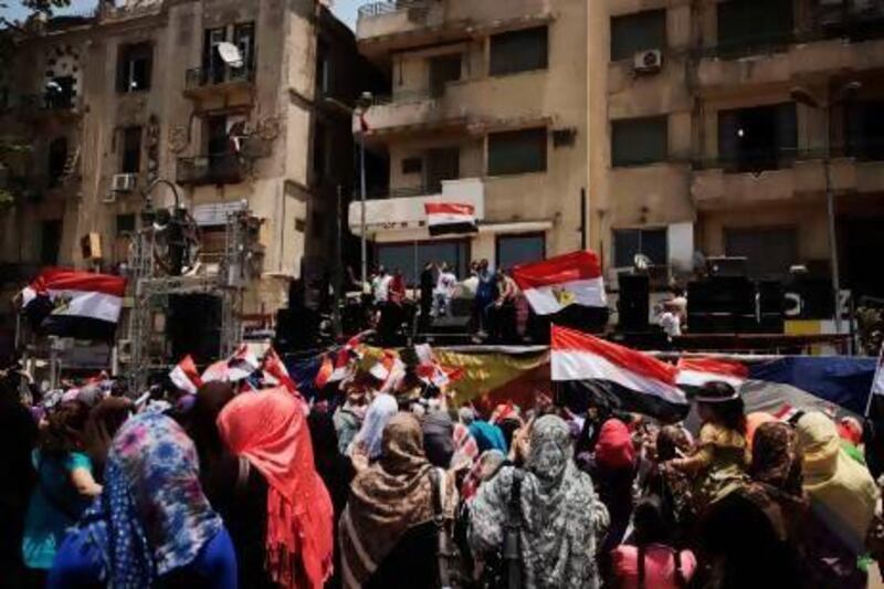 Egyptians cheer in Cairo's Tahrir Square after a night of celebrations following the toppling of ousted Egyptian president Mohammed Morsi.