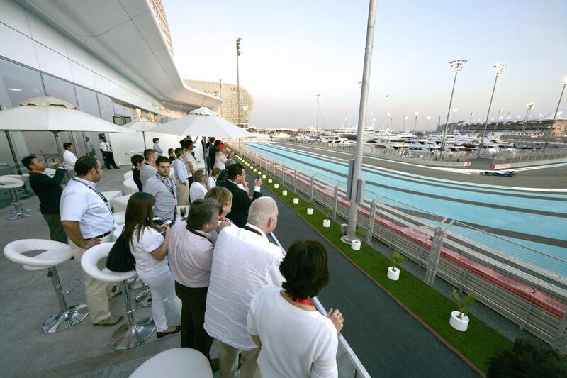 Guests watch a Formula One event from the Jenson Button suite at Yas Marina Circuit in Abu Dhabi. Courtesy Halcyon Events