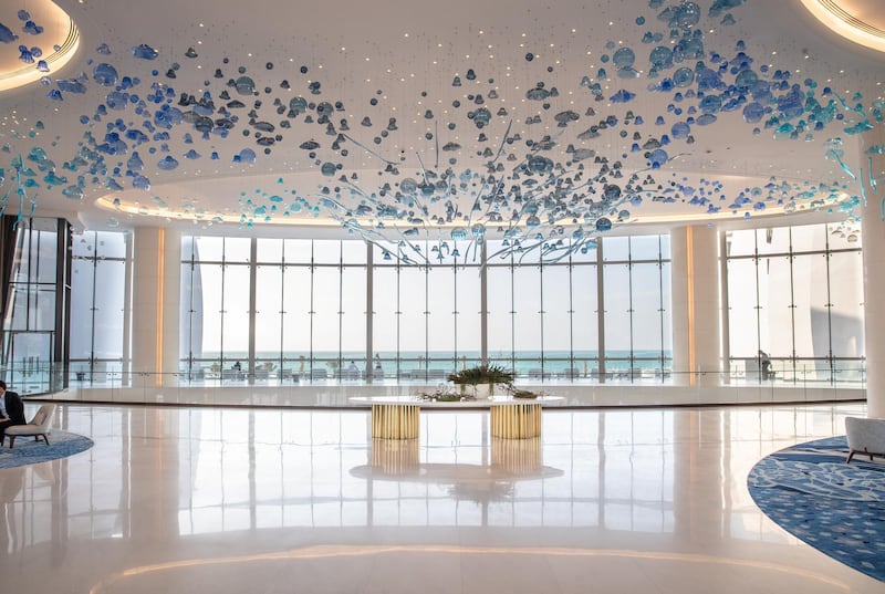 The lobby features a statement chandelier that resembles the seven colours of the Gulf sea. Jumeirah