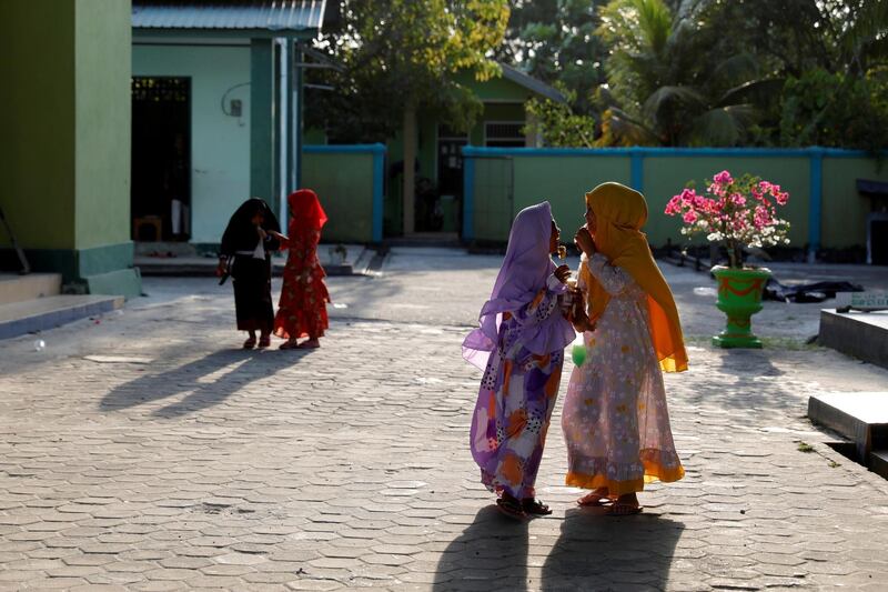 Muslim children play outside a mosque in North Penajam Paser regency, East Kalimantan province, Indonesia.  Reuters