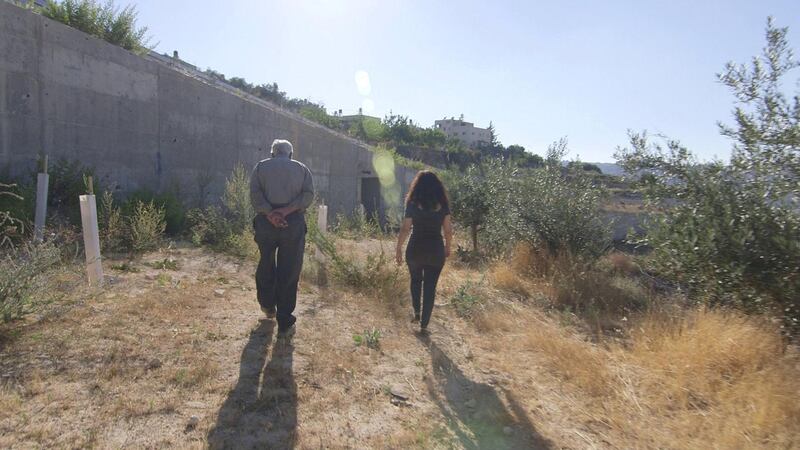 Vivien Sansour, one of the co-producers of The Golden Harvest, walking with farmer Abu Nidal, near the town of Walaji in the West Bank. 