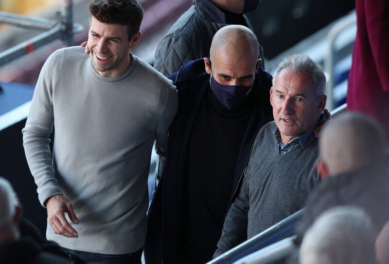 Left to right: Barcelona defender Gerard Pique, Manchester City manager Pep Guardiola and City director of football Txiki Begiristain before the press conference. Reuters
