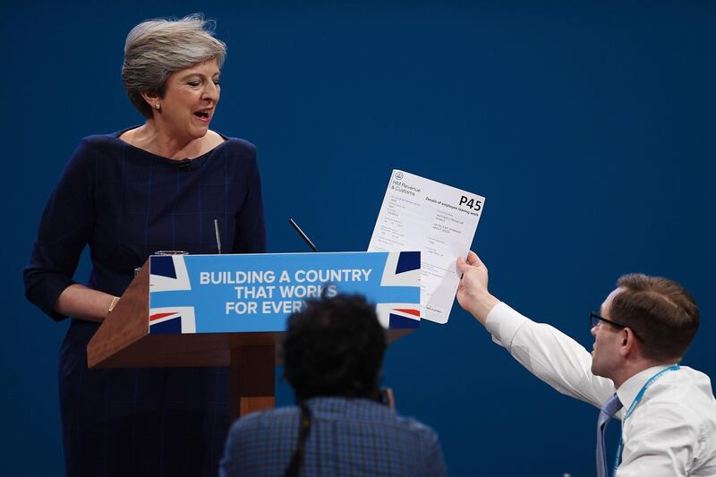 Mrs May gets her P45 by a pranksteter at Conservative Party Conference at Manchester Central on October 4, 2017. Getty Images