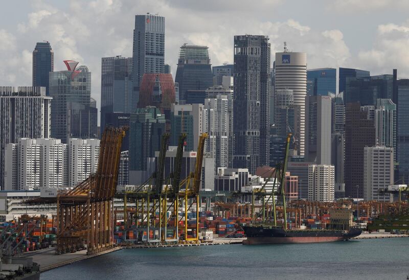 FILE PHOTO: A ship docks at Keppel terminal in Singapore November 17, 2020.  REUTERS/Edgar Su/File Photo
