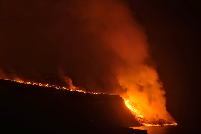 The lava reached the ocean nine days after it started to flow down the mountain, wrecking buildings and destroying crops. Photo: AP