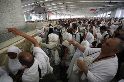 Muslim pilgrims perform the symbolic stoning of the devil ritual at Jamarat on Wednesday.  EPA 