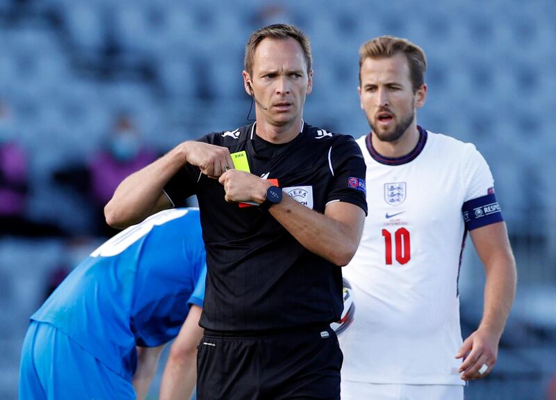 Referee Srdan Jovanovic after showing a second yellow and subsequent red card to England's Kyle Walker. Reuters