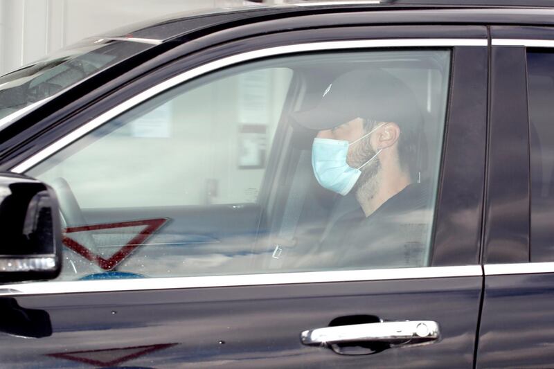 Juventus' Rodrigo Betancur arrives at Juventus Training Center wearing a protective face mask. Reuters