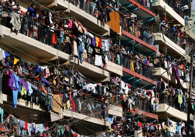 Residents watch as Kenya's opposition leader Raila Odinga and his supporters protest against President William Ruto's government, in Mathare settlement, Nairobi. Reuters