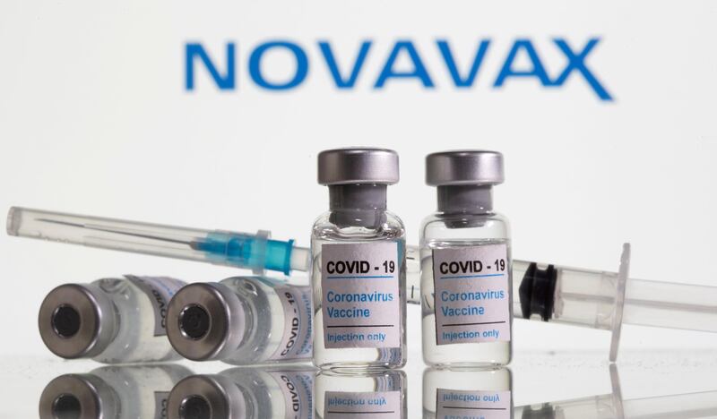 FILE PHOTO: Vials labelled "COVID-19 Coronavirus Vaccine" and syringe are seen in front of displayed Novavax logo in this illustration taken, February 9, 2021. REUTERS/Dado Ruvic/Illustration/File Photo