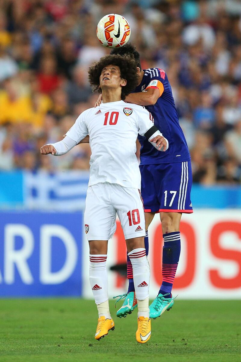 SYDNEY, AUSTRALIA - JANUARY 23:  Omar Abdulrahman of the United Arab Emirates competes with Makoto Hasebe of Japan during the 2015 Asian Cup Quarter Final match between Japan and the United Arab Emirates at ANZ Stadium on January 23, 2015 in Sydney, Australia.  (Photo by Brendon Thorne/Getty Images)