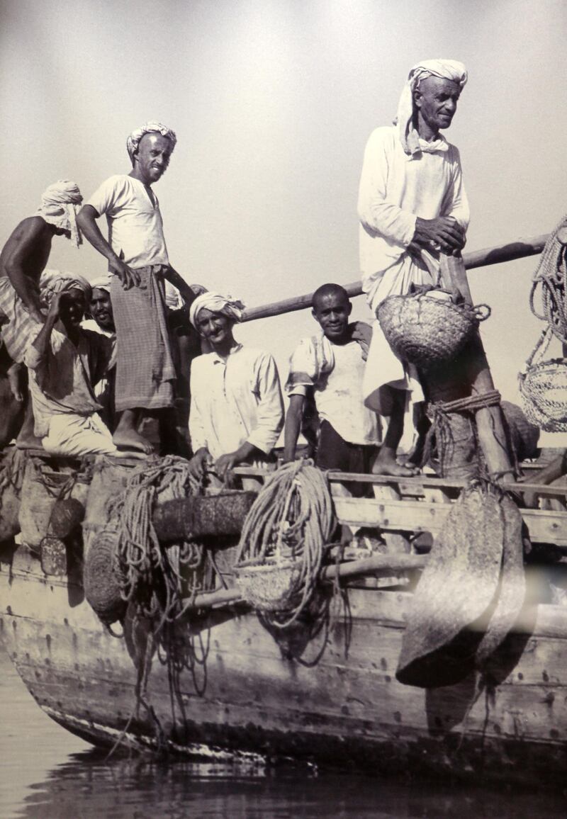 DUBAI , UNITED ARAB EMIRATES – July 16 , 2015 : Old photograph of the pearl divers on display at the Pearl Museum at Emirates NBD head office in Deira Dubai in Dubai. ( Pawan Singh / The National ) For News. Story by Vesela Todorova *** Local Caption ***  PS1607- PEARL MUSEUM25.jpg