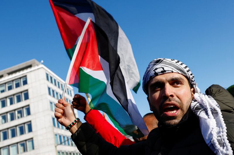 A pro-Palestinian demonstrator outside the International Court of Justice which was delivering an interim ruling on South Africa's genocide case against Israel. Reuters