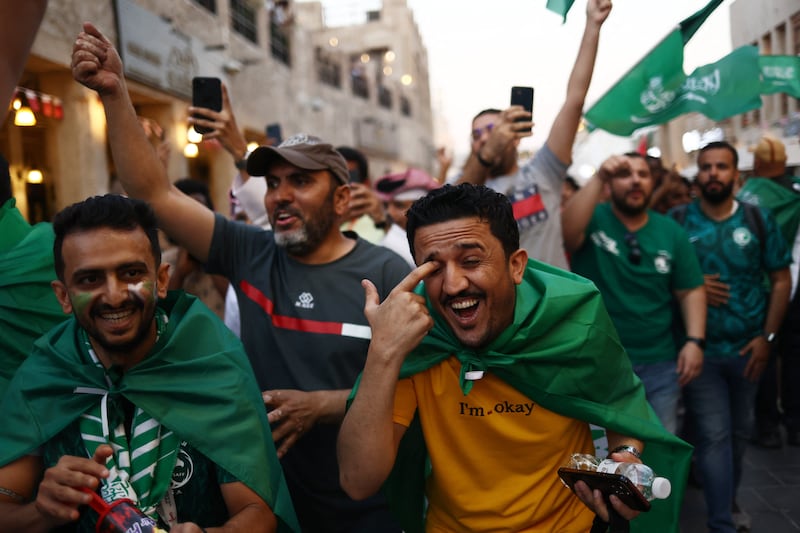 Saudi fans in Souq Waqif celebrate their team's surprise win over Argentina. Reuters