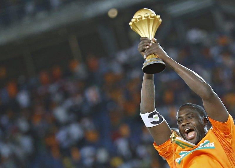Ivory Coast's captain Yaya Toure raises the trophy after winning the Africa Cup of Nations final against Ghana on Sunday. Amr Abdallah Dalsh / Reuters