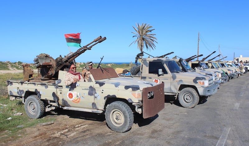 Vehicles and militants, reportedly from the Misrata militia, gather to join Tripoli forces, in Tripoli, Libya. EPA