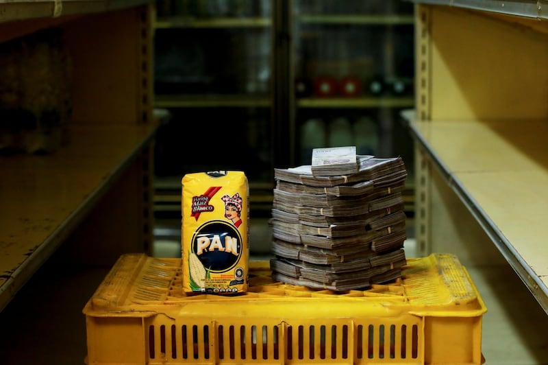 A package of corn flour is pictured next to 2,500,000 bolivars