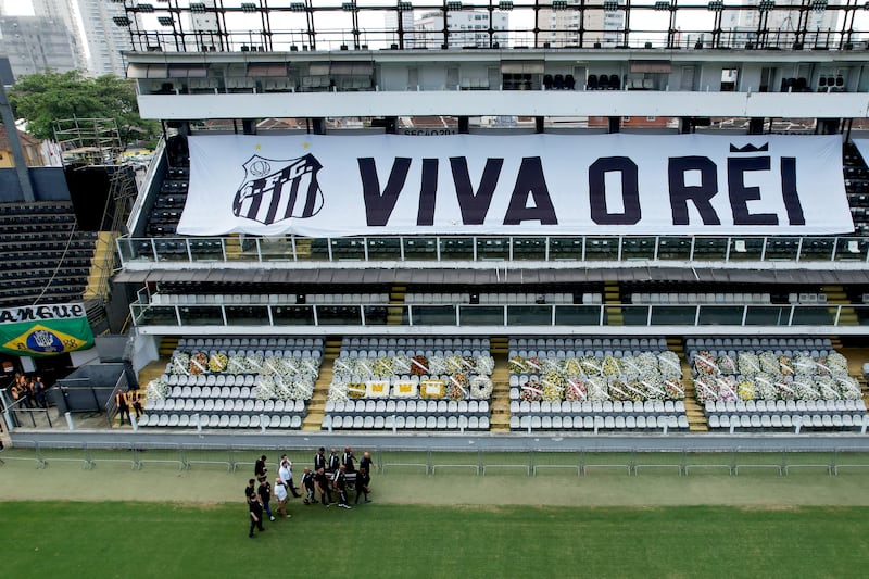 The casket of Brazilian football legend Pele arrives in Santos for the wake ceremony. Getty